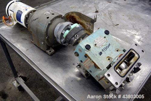 Used Waukesha Rectangular Flange Universal Rotary Positive Displacement Pump, Model 034, 316 Stainless Steel. Approximately 24 gallons per minute at 200 psi at 400 rpm, 0.060 gallon displacement per ...
