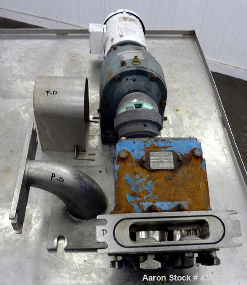 Used Waukesha Rectangular Flange Universal Rotary Positive Displacement Pump, Model 034, 316 Stainless Steel. Approximately 24 gallons per minute at 200 psi at 400 rpm, 0.060 gallon displacement per ...