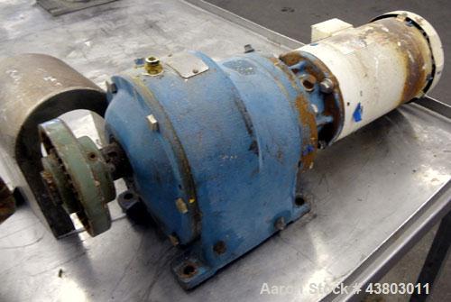 Used Waukesha Rectangular Flange Universal Rotary Positive Displacement Pump, Model 034, 316 Stainless Steel. Approximately 24 gallons per minute at 200 psi at 400 rpm, 0.060 gallon displacement per ...