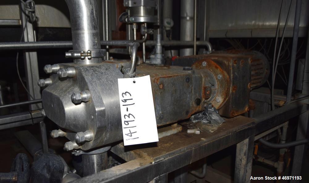 Used Waukesha Positive Displacement Pump, Model 130/U2, Stainless Steel. Approximate displacement 0.254 gallons per revolution, nominal capacity to 150 gallons per minute. Driven by a 5hp, 3/60/208-2...