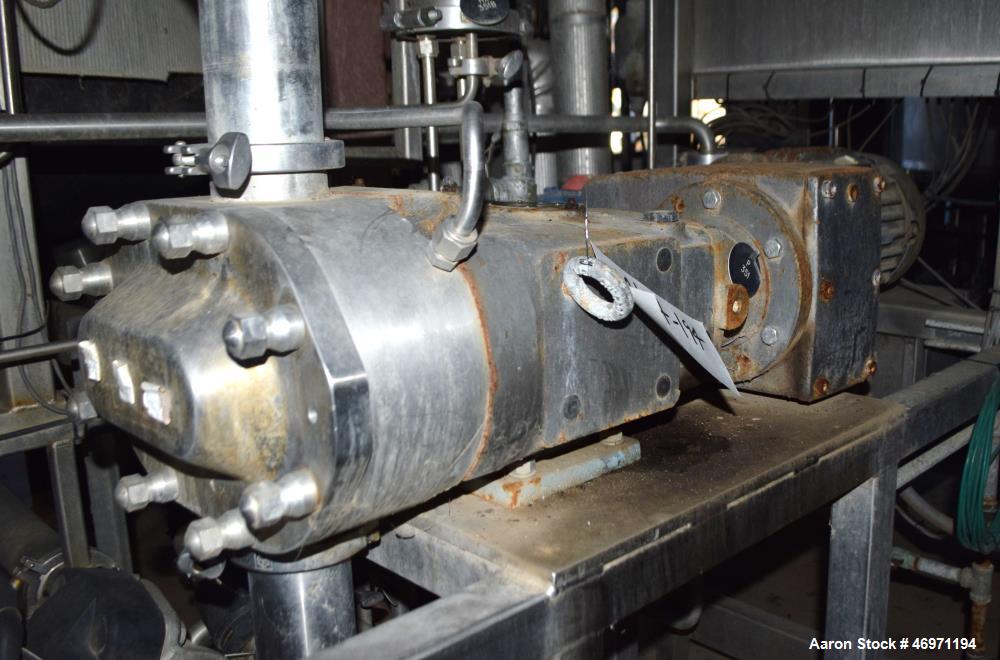 Used Waukesha Positive Displacement Pump, Model 130/U2, Stainless Steel. Approximate displacement 0.254 gallons per revolution, nominal capacity to 150 gallons per minute. Driven by a 5hp, 3/60/208-2...