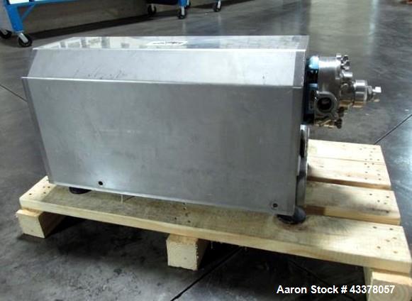 Used Waukesha Rotary Lobe Pump, Model 018, Stainless Steel. 1.5" Inlet/outlet, rated up to 20 gpm, on base with 1 hp, 230/460 volt motor drive, serial# 377392 05.