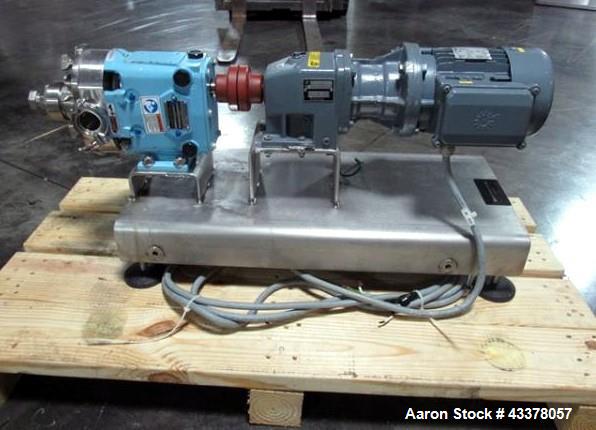 Used Waukesha Rotary Lobe Pump, Model 018, Stainless Steel. 1.5" Inlet/outlet, rated up to 20 gpm, on base with 1 hp, 230/460 volt motor drive, serial# 377392 05.