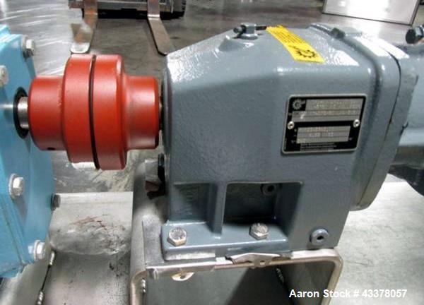 Used Waukesha Rotary Lobe Pump, Model 018, Stainless Steel. 1.5" Inlet/outlet, rated up to 20 gpm, on base with 1 hp, 230/460 volt motor drive, serial# 377392 05.
