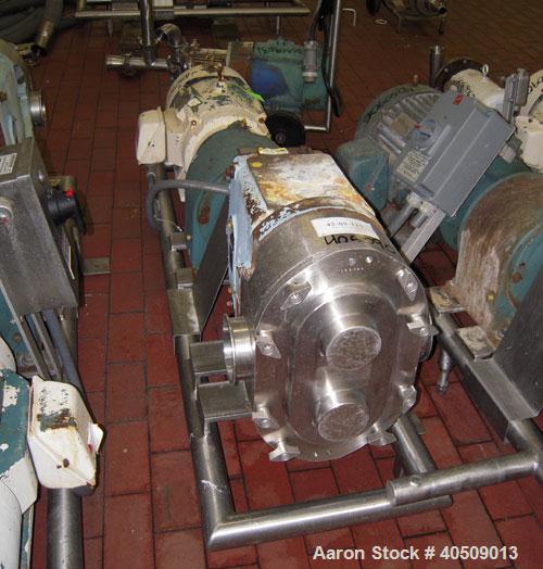Used Waukesha Rotary Positive Displacement Pump, Model 220, stainless steel. Approximate capacity 260 gallons per minute, .50 gallon displacement per revolution. 3 7/8" tri clamp inlet/outlet. Driven...