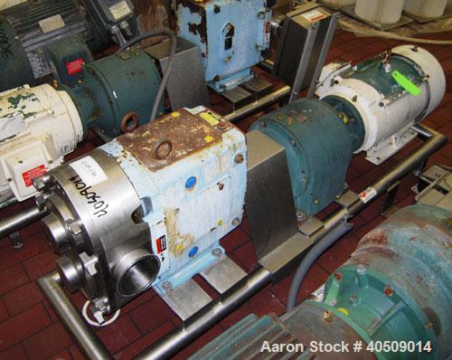 Used Waukesha Rotary Positive Displacement Pump, Model 220, stainless steel. Approximate capacity 260 gallons per minute, .50 gallon displacement per revolution. 3 7/8" tri clamp inlet/outlet. Driven...