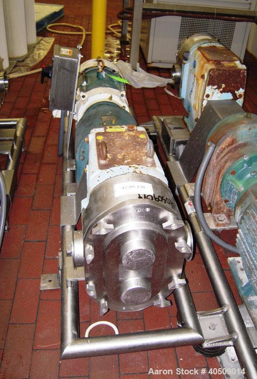Used Waukesha Rotary Positive Displacement Pump, Model 220, stainless steel. Approximate capacity 260 gallons per minute, .50 gallon displacement per revolution. 3 7/8" tri clamp inlet/outlet. Driven...