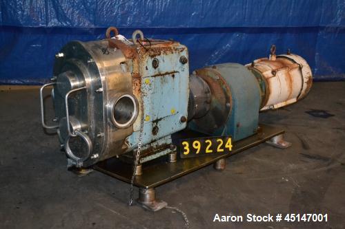 Used Waukesha Model 220 Positive Displacement Pump, 4" inlet/outlet, 10 hp gearhead drive, mounted on stainless base.