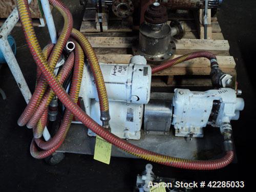 Used Waukesha Rotary Positive Displacement Pump, model 25, stainless steel. Approximately 25 gallons per minute, .060 gallon displacement per revolution. 1-1/2" inlet/outlet. Driven by a 3/4 hp varia...
