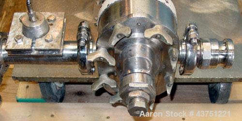 Used Waukesha Rotary Positive Displacement Pump, Model 25, 316 Stainless Steel. Approximately 25 gallons per minute. 2" Tri-clamp inlet/outlet, (2) stainless steel rotors, vented cover. Driven by a 3...