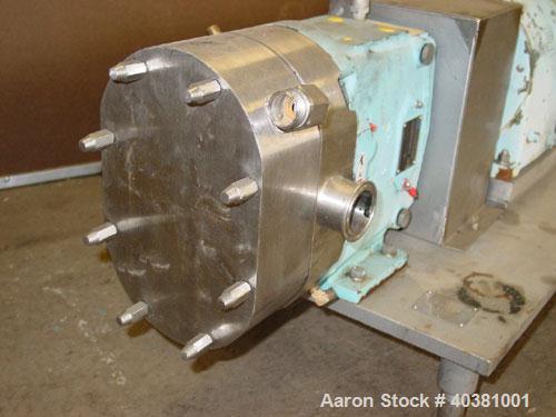 Used Waukesha Universal rotary positive displacement pump, model 30UL, 316 stainless steel. Approximate capacity 36 gallons per minute at 600 rpm. Jacketed cover, 1-1/2" tri clamp inlet/outlet. Drive...