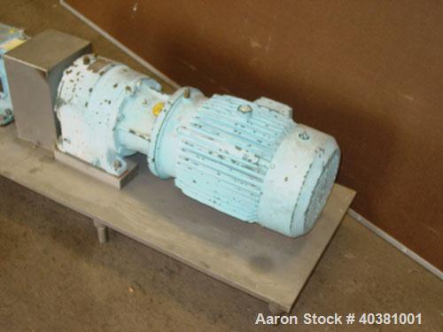 Used Waukesha Universal rotary positive displacement pump, model 30UL, 316 stainless steel. Approximate capacity 36 gallons per minute at 600 rpm. Jacketed cover, 1-1/2" tri clamp inlet/outlet. Drive...