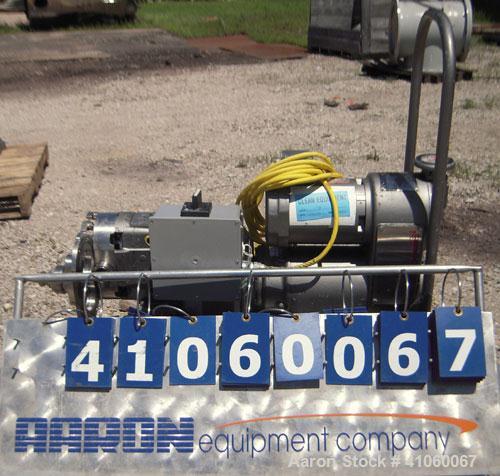 Used Waukesha Rotary Positive Displacement Pump, Model 030, 316 Stainless Steel. Approximately 36 gallons per minute at 100 psi at 600 rpm capacity, (.06) gallon displacement per revolution. 1 1/2" t...