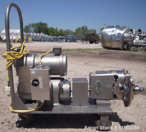 Used Waukesha Rotary Positive Displacement Pump, Model 030, 316 Stainless Steel. Approximately 36 gallons per minute at 100 psi at 600 rpm capacity, .06 gallon displacement per revolution. 1 1/2" tri...