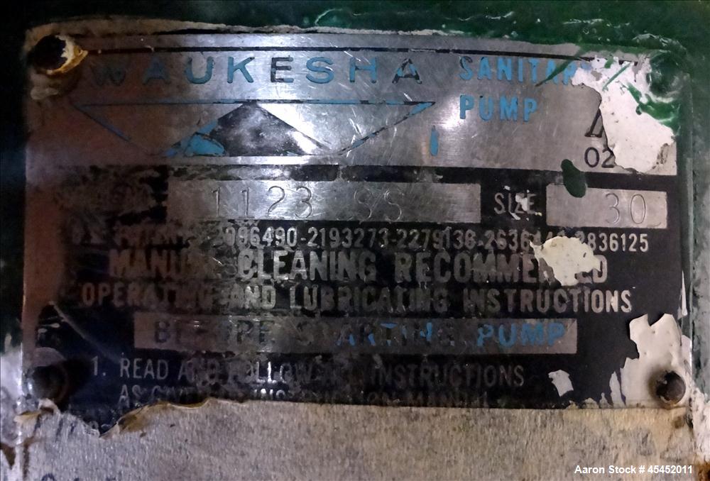 Used Waukesha Rotary Positive Displacement Pump, Model 030, 316 Stainless Steel. Approximately 36 gallons per minute at 100 psi at 600 rpm capacity. 2" Tri-clamp inlet/outlet, (2) 4 " diameter stainl...