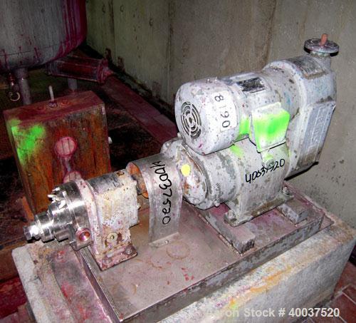 Used Waukesha rotary positive displacement pump, model 3, stainless steel. 1-1/2" NPT inlet/outlet. (2) stainless rotors, vented cover. Driven by a 1 1/2 hp, 3/60/230/460 volt, 1730 rpm vari speed mo...