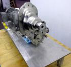 Used Waukesha Rotary Positive Displacement Pump, Model 006, 316 Stainless Steel. Approximately 6 gallons per minute at 200 psi at 800 rpm capacity, (.0082) gallon displacement per revolution. 1