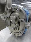 Used Waukesha Rotary Positive Displacement Pump, Model 006, 316 Stainless Steel. Approximately 6 gallons per minute at 200 psi at 800 rpm capacity, (.0082) gallon displacement per revolution. 1