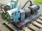 Used Waukesha Rotary Positive Displacement Pump, Model 030U2, 316 Stainless Steel. Approximately 36 gallons per minute at 100 psi at 600 rpm capacity, (.06) gallon displacement per revolution. 1-1/2