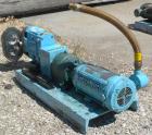 Used Waukesha Rotary Positive Displacement Pump, Model 030US-AP, 316 Stainless Steel. Approximately 36 gallons per minute at 100 psi at 600 rpm capacity, .06 gallon displacement per revolution. 1-1/2...