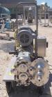Used Waukesha Rotary Positive Displacement Pump, Model 030, 316 Stainless Steel. Approximately 36 gallons per minute at 100 psi at 600 rpm capacity, .06 gallon displacement per revolution. 1 1/2