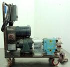 Used Waukesha Rotary Positive Displacement Pump, Model 030, 316 Stainless Steel. Approximately 36 gallons per minute at 100 psi at 600 rpm capacity, (.06) gallon displacement per revolution. 1-1/2
