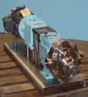 Used Waukesha Universal Rotary Positive Displacement Pump, Model 060, 316 Stainless Steel. Approximately 90 gallons per minute at 200 psi at 600 rpm. 0.153 gallons displacement per revolution. 2-1/2