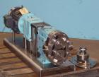 Used Waukesha Universal Rotary Positive Displacement Pump, Model 060, 316 Stainless Steel. Approximately 90 gallons per minute at 200 psi at 600 rpm. 0.153 gallons displacement per revolution. 2-1/2