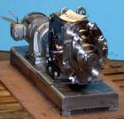 Used Waukesha Universal Rotary Positive Displacement Pump, Model 060, 316 Stainless Steel. Approximately 90 gallons per minute at 200 psi at 600 rpm. 0.153 gallons displacement per revolution. 2-1/2