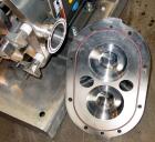 Used Waukesha Universal Rotary Positive Displacement Pump, Model 060, 316 Stainless Steel. Approximately 90 gallons per minute at 200 psi at 600 rpm. 0.153 gallons displacement per revolution. 2-1/2