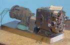 Used Waukesha Universal Rotary Positive Displacement Pump, Model 060, 316 Stainless Steel. Approximately 90 gallons per minute at 200 psi at 600 rpm. 0.153 gallons displacement per revolution. 2-1/2