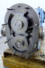 Used Waukesha Universal Rotary Positive Displacement Pump, Model 060, 316 Stainless Steel. Approximately 90 gallons per minute at 200 psi at 600 rpm. (0.153) gallons displacement per revolution. 2-1/...