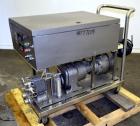 Used Waukesha Rotary Positive Displacement Pump, Model 15, 316 Stainless Steel. Approximately 9 gallons per minute at 200 psi at 700 rpm capacity, (.014) gallon displacement per revolution. 1-1/2