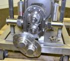 Used Waukesha Rotary Positive Displacement Pump, Model 15, 316 Stainless Steel. Approximately 9 gallons per minute at 200 psi at 700 rpm capacity, (.014) gallon displacement per revolution. 1-1/2