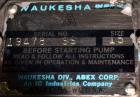 Used Waukesha Rotary Positive Displacement Pump, Model 15, 316 Stainless Steel. Approximately 9 gallons per minute at 200 psi at 700 rpm capacity, (.014) gallon displacement per revolution. 1-1/2