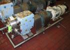 Used Waukesha Rotary Positive Displacement Pump, Model 220, stainless steel. Approximate capacity 260 gallons per minute, .50 gallon displacement per revolution. 3 7/8
