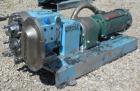 Used Waukesha Rotary Positive Displacement Pump, Model 030U2AP, 316 Stainless Steel. Approximately 36 gallons per minute at 100 psi at 600 rpm capacity, .06 gallon displacement per revolution. 1-1/2