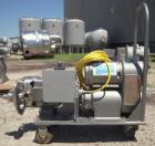 Used Waukesha Rotary Positive Displacement Pump, Model 030, 316 Stainless Steel. Approximately 36 gallons per minute at 100 psi at 600 rpm capacity, (.06) gallon displacement per revolution. 1 1/2