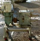 USED: Waukesha positive displacement pump parts consisting of (1) model 320 gear housing, (2) shafts and a 3 hp, 3/60/230/460 volt, 1725 rpm Dodge gearmotor, ratio 30. Mounted on a stainless steel st...
