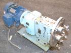 Used Waukesha Rotary Positive Displacement Pump, Model 60, 316 Stainless Steel. Approximately 90 gallons per minute at 200 psi at 600 rpm. (.153) gallons displacement per revolution. 2-1/2