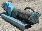 Used Waukesha Rotary Positive Displacement Pump, Model AP-030, 316 Stainless Steel. Approximately 36 gallons per minute at 100 psi at 600 rpm capacity, .06 gallon displacement per revolution. 1-1/2