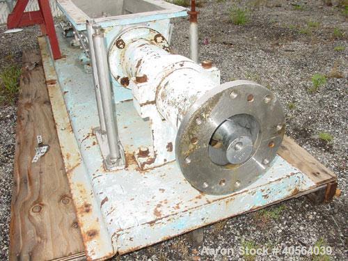 Used Moyno 2 Stage Processing Cavity Pump, Model 2G0GS2/SSQ, Trim AAA. 36 gallons per revolution at 160 psi. Open throat design with feed screw. 5 1/2" discharge. Chrome plated rotor, nitrile stator....