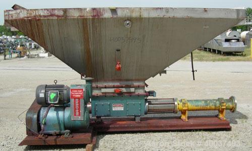 Used Moyno pump, model 2JOJS3 SSQ, trim AEA-NK. Open throat design with lump breaker, and feed screw. 8" discharge. 316 stainless steel hopper and rotor, nitrile stator. Driven by a 10hp,3/60/230/460...