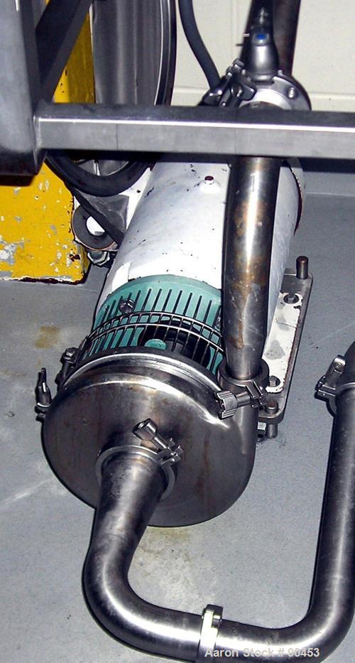 Used: Tri Clover centrifugal pump, model C218MD18T-S-3-18, 316 stainless steel. Approximately 95 gallons per minute at 45' head at 20 psi. 2" inlet, 1 1/2" outlet, 7" diameter impeller. Driven by a 3...