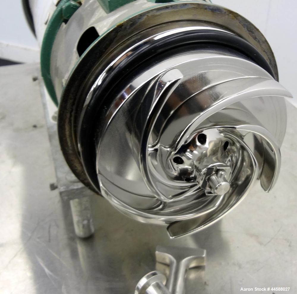 Used Tri-Clover Tri-Flo H.D. Series Centrifugal Pump, Model C215MDG56T-S, 316 Stainless Steel.  Approximate capacity 60 gallons per minute.  2” Tri-clamp inlet, 1-1/2” tri-clamp outlet.  Driven by a ...