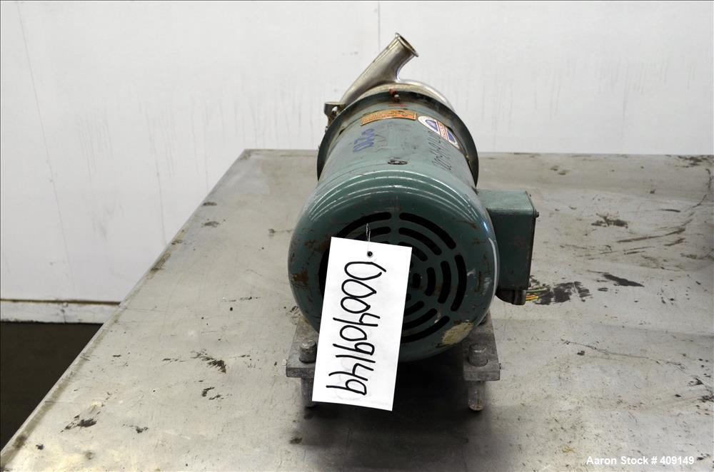 Used Tri-Clover Centrifugal Pump, Model C216MDG18T-S, 316 Stainless Steel. Approximate 80 gallons per minute at 100' head. 2" Tri-clamp inlet, 1-1/2" tri-clamp outlet. Driven by a 5hp, 3/60/208-230/4...
