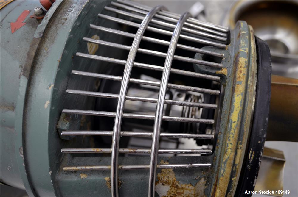 Used Tri-Clover Centrifugal Pump, Model C216MDG18T-S, 316 Stainless Steel. Approximate 80 gallons per minute at 100' head. 2" Tri-clamp inlet, 1-1/2" tri-clamp outlet. Driven by a 5hp, 3/60/208-230/4...