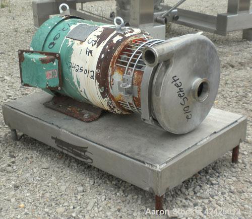 Used Tri-Clover Centrifugal Pump, Model C218MDG21T-20ND-O2U-09SP, 316 Stainless Steel. 2" Sanitary inlet, 1-1/2" sanitary outlet. Approximate 6 3/4" diameter impeller. Rated approximately 180 gallons...
