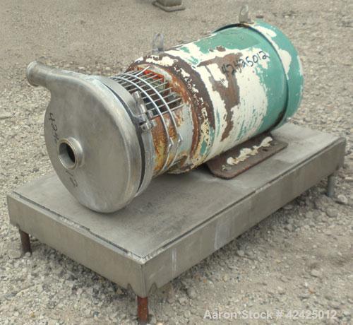 Used Tri-Clover Centrifugal Pump, Model C218MDG21T-20ND-O2U-09SP, 316 Stainless Steel. 2" Sanitary inlet, 1-1/2" sanitary outlet. Approximate 6 3/4" diameter impeller. Rated approximately 180 gallons...