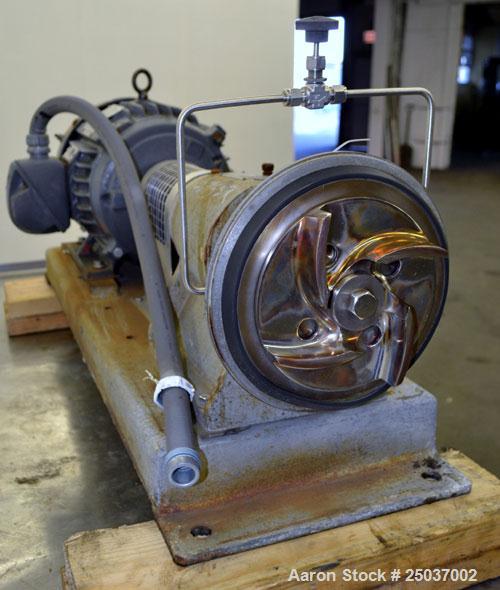 Used Tri-Clover Centrifugal Pump, Model SP218M-9237-40, 316 Stainless Steel. Unit missing front cover. Driven by a 10 hp, 3/60/460 volt, 3510 rpm motor. Mounted on a carbon steel base.